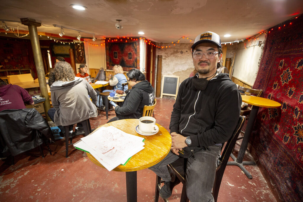 Lonnie Allen gets ready to start sketching during Denver Drink and Draw's Nov. 23 hangout in the basement of St. Mark's Coffee House in City Park West.