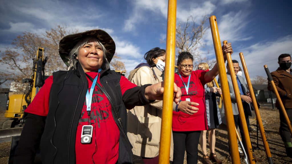 Angelina Torres holds a shovel before Tierra Colectiva breaks ground on five new affordable townhomes in Elyria Swansea. Dec. 8, 2021.