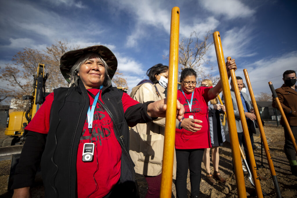 Angelina Torres holds a shovel before Tierra Colectiva breaks ground on five new affordable townhomes in Elyria Swansea. Dec. 8, 2021.
