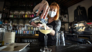Chelsie Kipp mixes up a "honeybee sage" at Awake Sober Bar and Coffee House. Dec. 18, 2021.