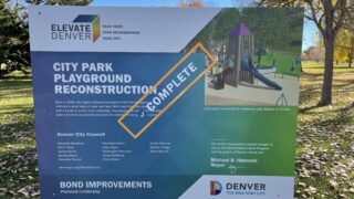 A sign announcing the completion of the City Park Playground, November 5, 2021