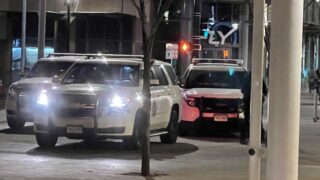 Denver police parked outside the Union Station bus terminal on December 8, 2021.