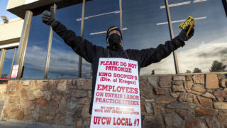 Chris Arceo protests with his King Soopers colleagues outside of the Sheridan Boulevard and Florida Avenue location in Denver's Mar Lee neighborhood. Jan. 12, 2022.