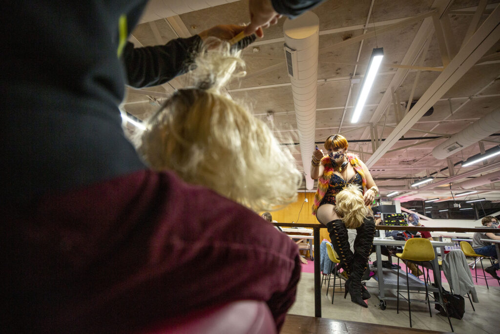 Charlie Fleming, AKA Diamond Starr, teaches wig preparedness at their Drag Teen-Tween Fashion class in Stanley Marketplace's Factory Fashion. Jan. 13, 2022.