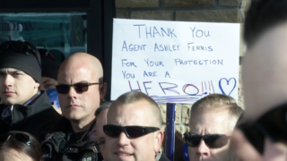 Lakewood police officers cheer on Ashely Ferris as she leaves the hospital.