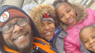 Chy Reco takes a selfie with three of his children on a trip to Chicago.