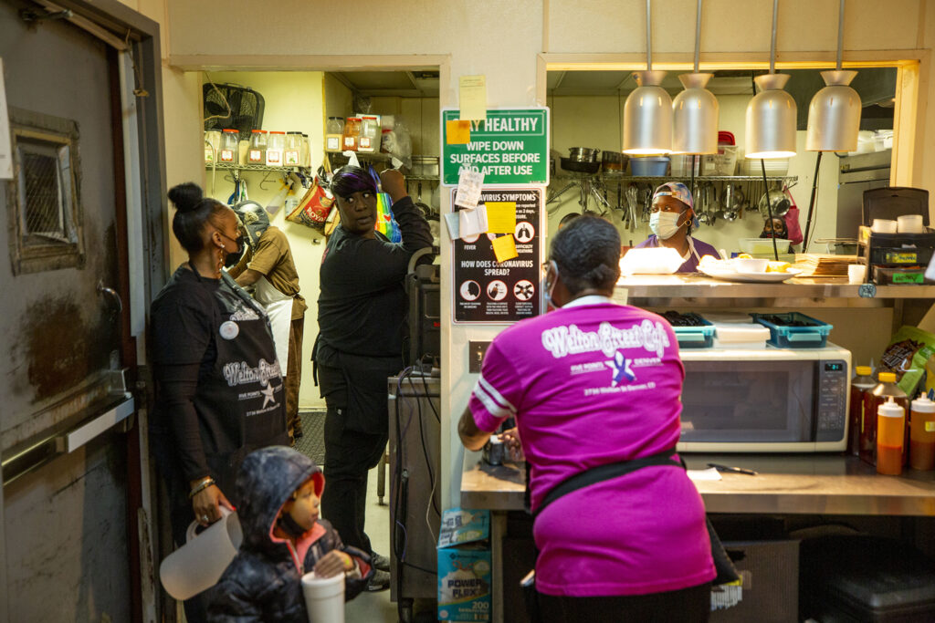 The kitchen at Welton Street Cafe buzzes as a fundraiser for the business kicks off at Spangalang Brewery next door. Feb. 4, 2022.