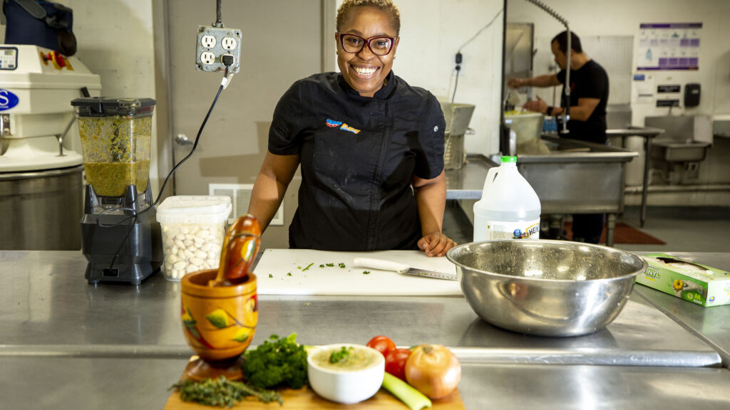 Fritay Haitian Cuisine owner Farah-Jane Jean Pierre blends vegetables into Haitian epis at the Kitchen Network's commissary kitchen on Morrison Road. March 8, 2022.