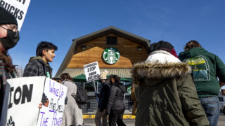 Starbucks employees and their supporters picket outside of a shop on East Colfax Avenue. March 11, 2022.