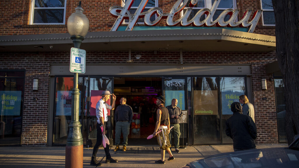 Jugglers Christian Kloc and Jonathan Canby stand outside the historic Holiday Theater before MCA Denver holds the first show of their long-term lease there. April 7, 2022.