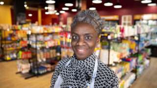 LaSheita Sayer, founder of Melody Market, stands inside her new Welton Street storefront. April 26, 2022.