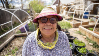 Dolores Alfaro stands in her backyard garden, which has been supercharged with nonprofit GrowHaus' help. May 11, 2022.