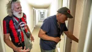 Max Hutchinson and Kevin Bastow enter their new place in Capitol Hill. May 17, 2022.