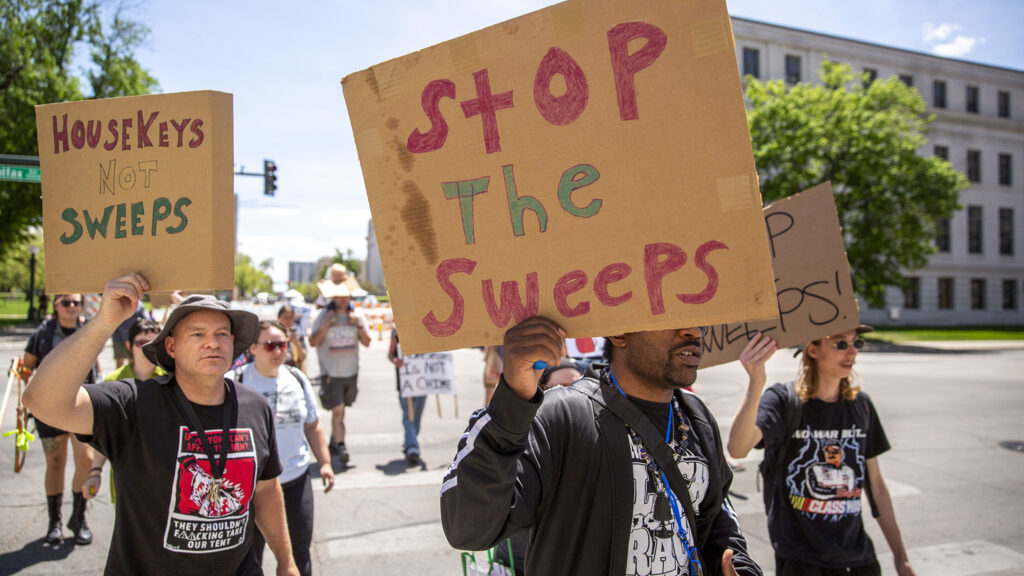 A march protesting ten years of Denver's urban camping ban, the last day in a week of events decrying the "decade of doom." May 14, 2022.