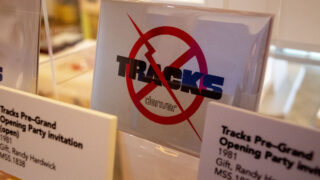 An invitation to Tracks' opening night party on display in History Colorado's new Rainbows and Revolutions exhibit. June 3, 2022.