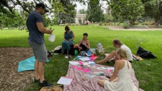 Poets gather under the Poet Tree in Cheesman Park, June 19, 2022.