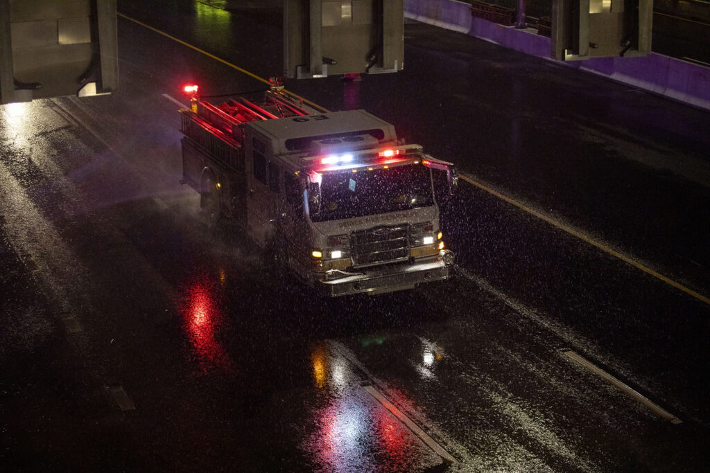 A fire truck drives on the new I-70 underpass through Elyria Swansea after heavy rains flooded the area on Aug.  7, 2022.