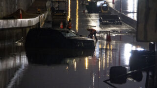 A truck is submerged in a work area next to the new I-70 underpass that flooded during heavy rain. Aug. 7, 2022.
