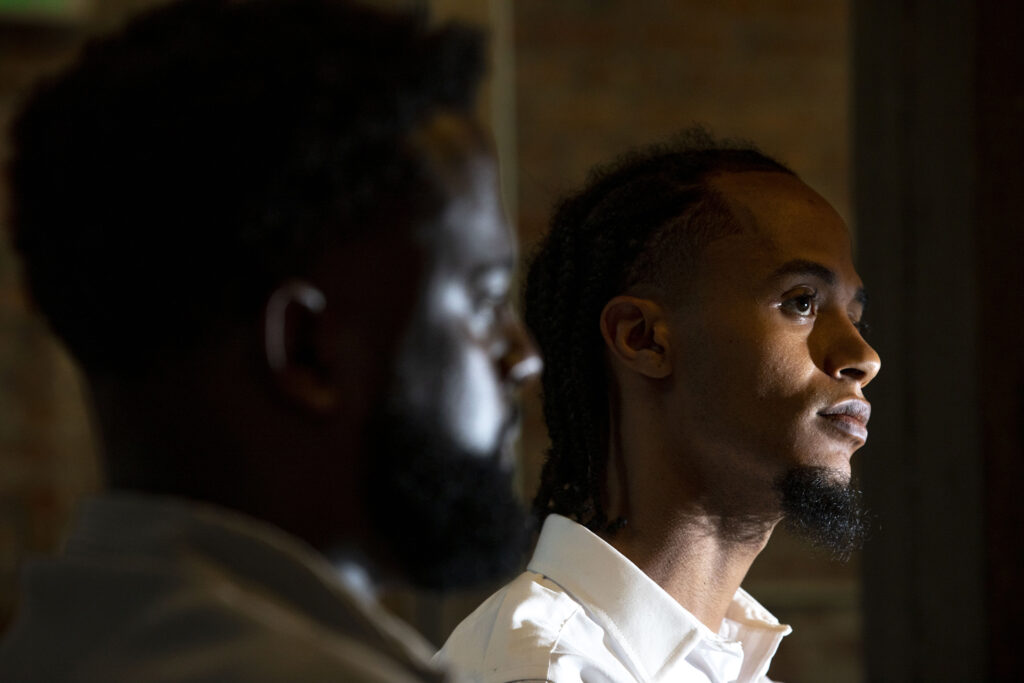 Yekalo Weldehiwet (left) and Willis Small sit inside the Rathod Mohamedbhai law office in Five Points. Aug. 17, 2022.