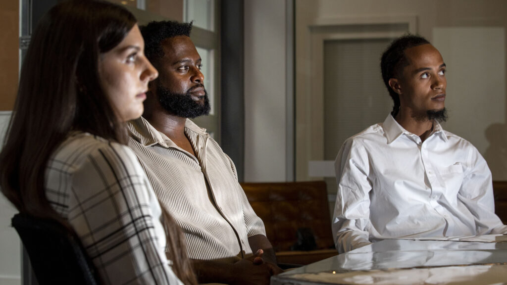 Bailey Alexander (left to right) Yekalo Weldehiwet and Willis Small sit inside the Rathod Mohamedbhai law office in Five Points. Aug. 17, 2022.