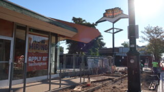A large “Now Hiring” sign fills one of the front windows of Tom’s Diner on Colfax Ave on Aug 3, 2022. The restaurant will reopen as Tom’s Starlight, a new cocktail lounge, in early September.