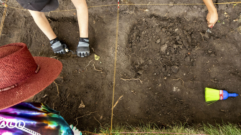 Metropolitan State University students Julie Martinez (left to right), Preston Reynolds and Camryn Baucom excavate a section of Denver's Auraria Campus where a carriage house stood before the city transformed the neighborhood into an education hub. Sept. 9, 2022.
