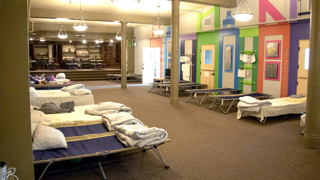 Cots line a room in the Denver Community Church of Christ's basement on May 14, 2019, when 55 migrants were bused to Denver from New Mexico after nonprofits there were unable to keep up with demand.