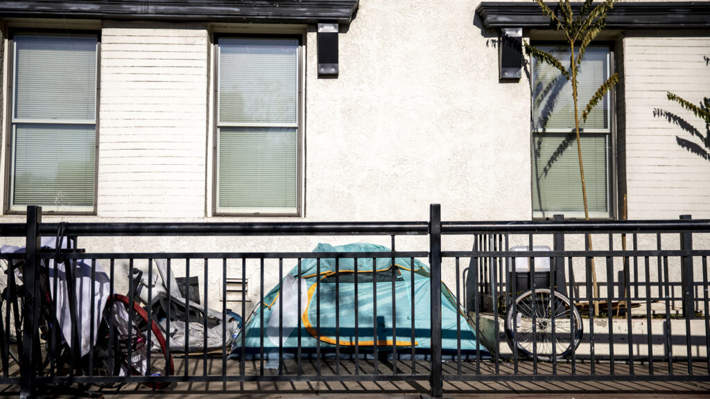 Someone's tent is pitched on a patio near Coors Field. Nov. 16, 2022.