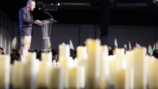 Faith leaders spoke to a crowd of hundreds mourning the lives lost at Club Q. Brien Hollowell for Denverite.