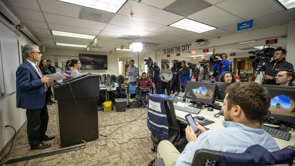 Mayor Hancock's deputy chief of staff Evan Dreyer speaks at a press conference in Denver's Emergency Operations Center, in the City and County Building basement. Dec. 8, 2022.