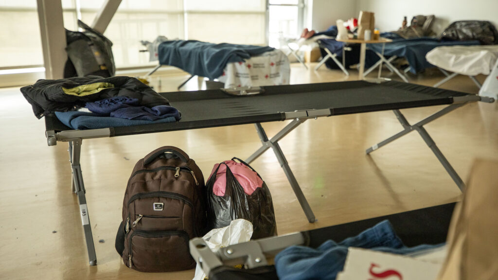 Cots set up in an emergency shelter for people arriving from the southern U.S. border, set up at a Denver rec center. Dec. 13, 2022.