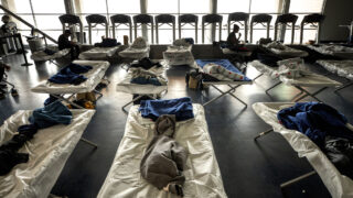 Cots set up in an emergency shelter for people arriving from the southern U.S. border, set up at a Denver rec center. Dec. 13, 2022.