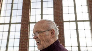 Retired English teacher and East High School museum curator Richard Nelson tells stories in East's clocktower. Dec. 14, 2022.