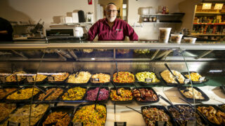 East Side Kosher Deli owner Joshua Horowitz behind his counter. Dec. 20, 2022.