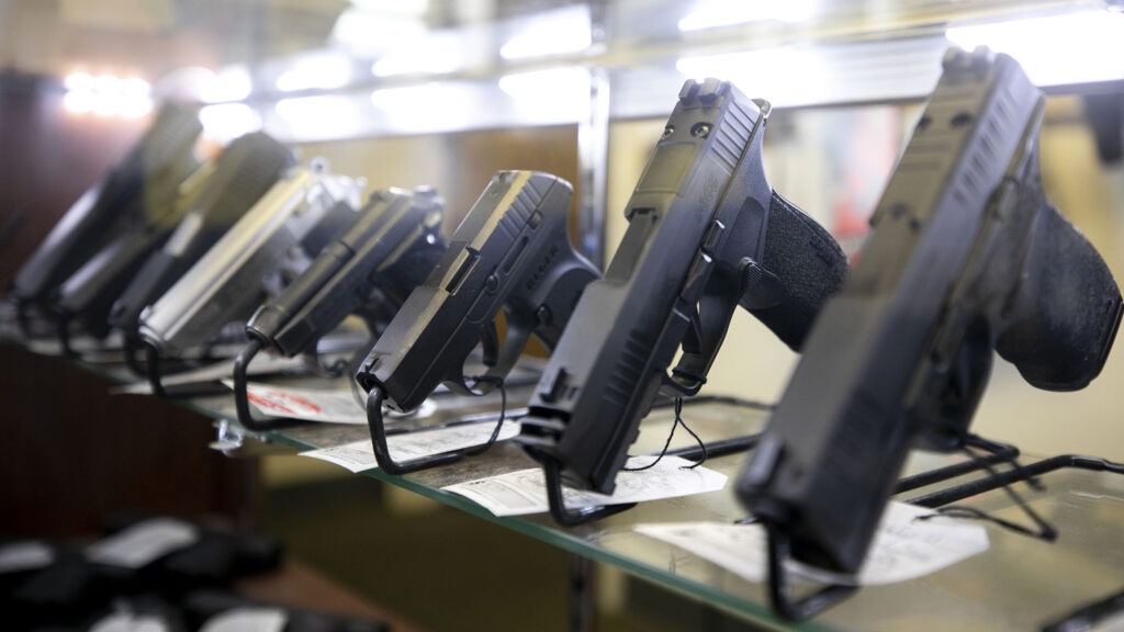 Handguns for sale at High Country Armory on 13th Avenue in La Alma/Lincoln Park. Dec. 21, 2022.