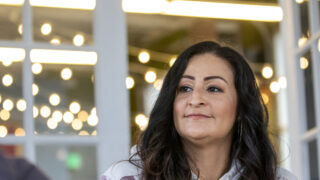 Hilda Gutierrez sits at a table inside Prodigy Coffeehouse's location off Colorado Boulevard. Dec. 28, 2022.