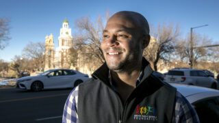 Kwame Spearman, owner and CEO of the Tattered Cover, stands on East Colfax Avenue. Jan. 10, 2023.