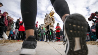 Claudia Buchanan skips rope with the 40-Plus Double Dutch Club as Denver's annual Martin Luther King Jr. Day Marade begins at City Park. Jan. 16, 2023.