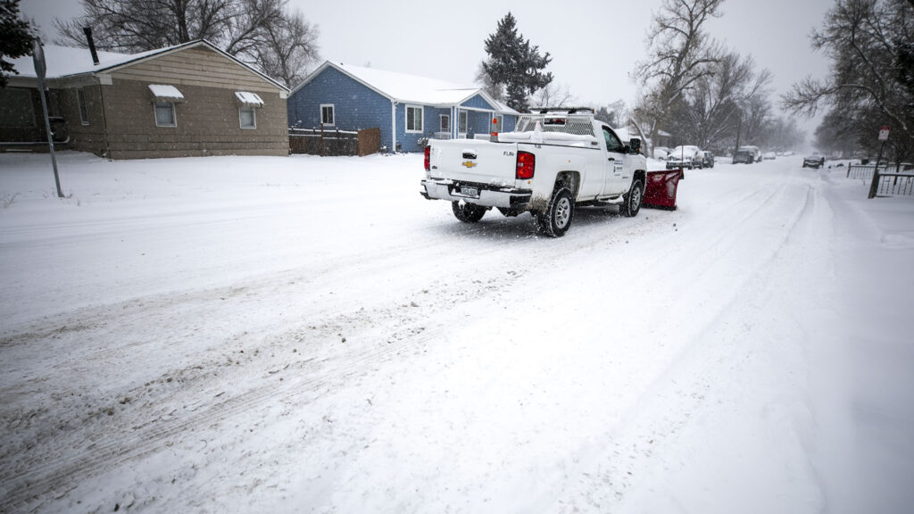 A residential plow deployed by Denver's Department of Transportation and Infrastructure works streets in Mar Lee. Jan. 18, 2023.