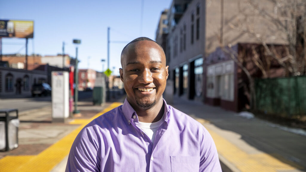 District 9 candidate Kwon Atlas stands along Welton Street. Feb. 7, 2023.