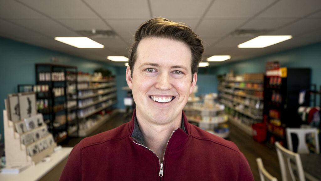 District 8 candidate Bradley Revare inside Wholesome Remedies, a small business in East Colfax he's frequented as he's campaigned. Feb. 10, 2023.