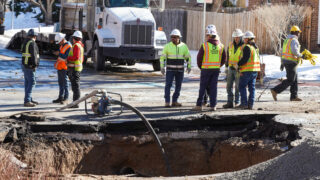 Crews work on damages caused by a water line break at E. 9th Avenue and Eudora Street on Feb. 2, 2023.