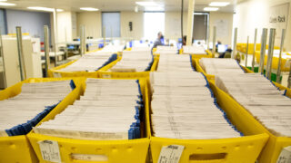 Lots and lots of ballots in need of processing at Denver's Election Division headquarters on Bannock Street. April 5, 2023.