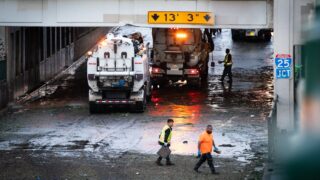 Crews pump out and clean up 38th Avenue where it passes underneath railroad bridges and Interstate 25 in Denver after flooding caused by heavy rain and hail Thursday afternoon, June 29, 2023.