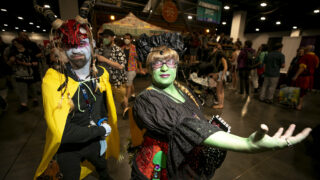 Josh Morse and Emily Thatcher are a D&D orc and tiefling at FAN EXPO Denver. July 1, 2023.