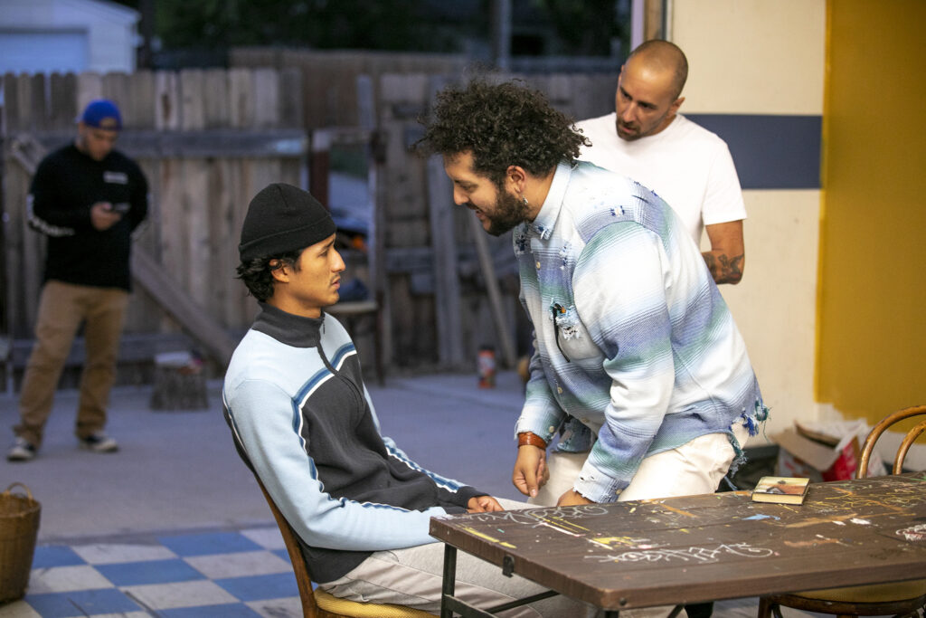 Actors Diego Estrada Bernuy (left to right), Jesse Pacheco and Sid Madrid rehearse a scene for "Cuauhtémoczin," a play by Diego Florez-Arroyo, in Florez-Arroyo's Westwood garage. Sept. 20, 2023.