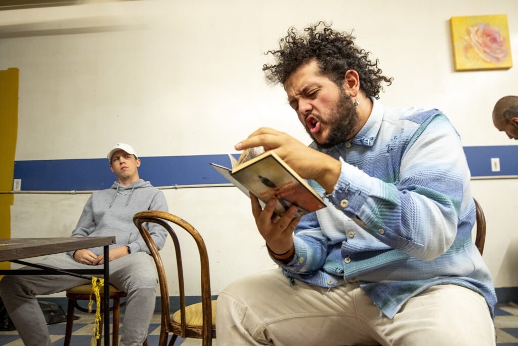 Jesse Pacheco (right) and Dillon Autry rehearse a scene in "Cuauhtémoczin," a play by Diego Florez-Arroyo, in Florez-Arroyo's Westwood garage. Sept. 20, 2023.