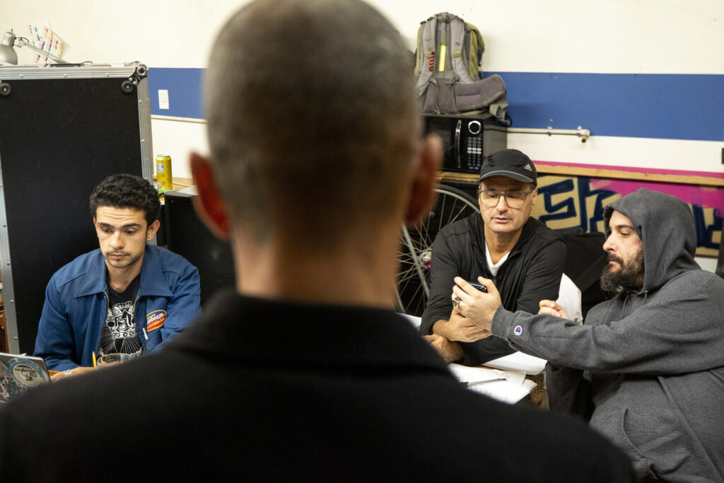 "Cuauhtémoczin" writer Diego Florez-Arroyo (left to right), director Phil Luna and stage manager James Jewkes work on a rehearsal in Florez-Arroyo's Westwood garage. Sept. 20, 2023.