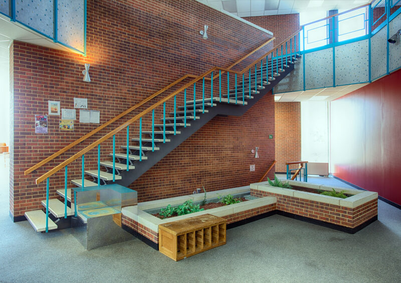 With the city's acquisition of Loretto Heights' library and theater