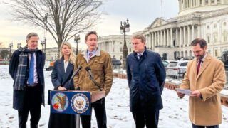 Flanked by Sen. John Hickenlooper, Rep. Brittany Pettersen, Sen. Michael Bennet and Rep. Jason Crow, from left, Denver Mayor Mike Johnston talks to reporters Thursday, Jan. 18, 2024, outside the U.S. Capitol.